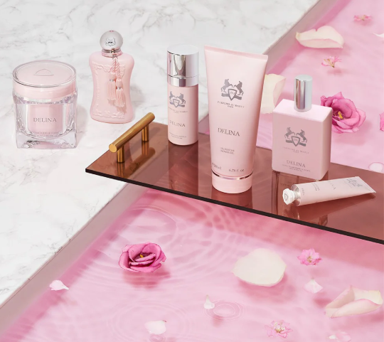 There are several Parfums de Marly collection products on the table.